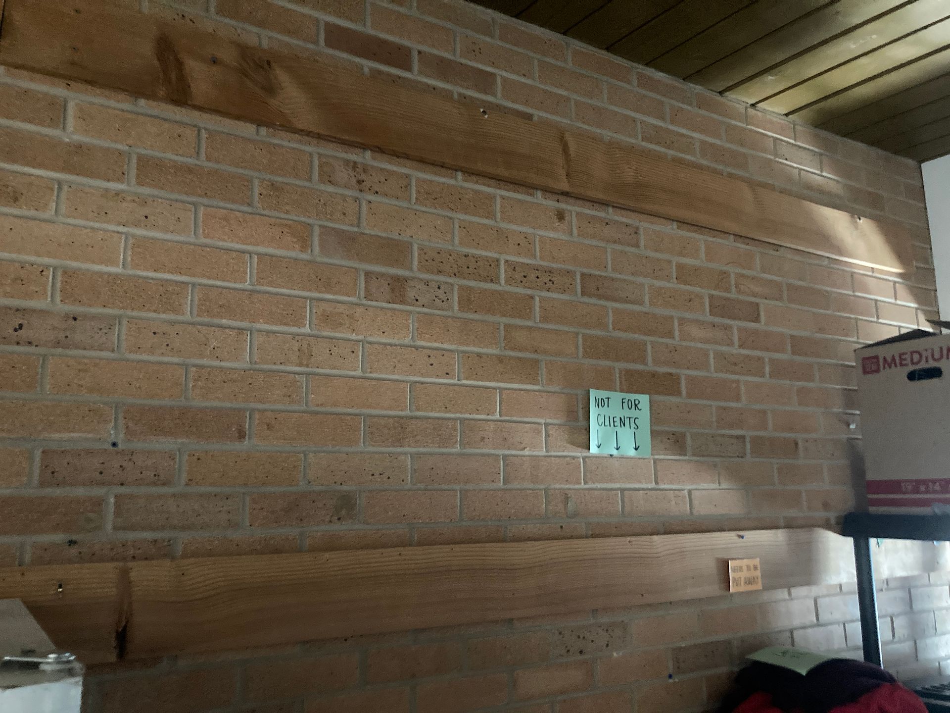 Install hanging rails on brick wall